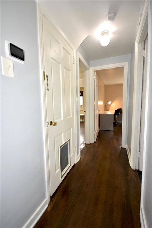 104 Earlwood Road Pittsburgh, PA 15235 - Photo 15 of 40 a view of a hallway with wooden floor and a bathroom