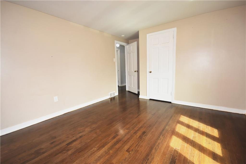 104 Earlwood Road Pittsburgh, PA 15235 - Photo 19 of 40 a view of an empty room and wooden floor