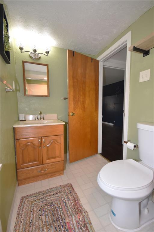 104 Earlwood Road Pittsburgh, PA 15235 - Photo 22 of 40 a bathroom with a toilet sink and mirror