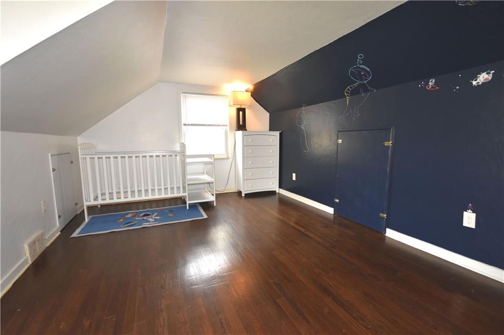 104 Earlwood Road Pittsburgh, PA 15235 - Photo 23 of 40 an empty room with wooden floor and windows
