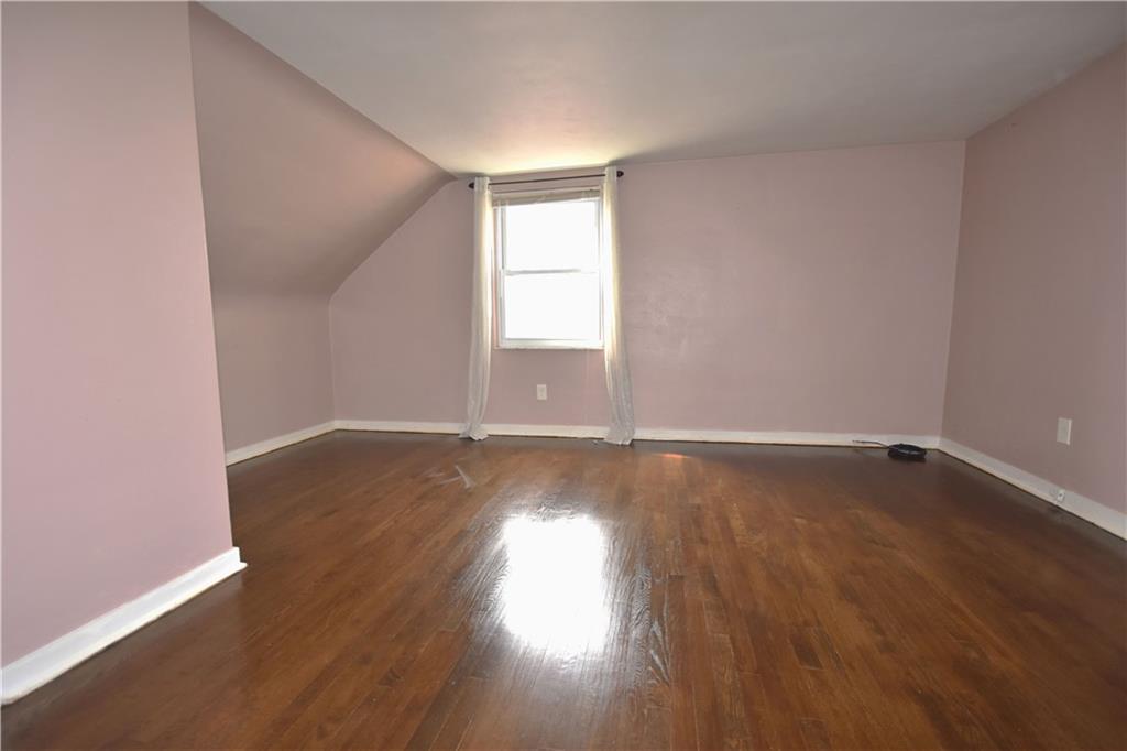 104 Earlwood Road Pittsburgh, PA 15235 - Photo 26 of 40 an empty room with wooden floor and windows