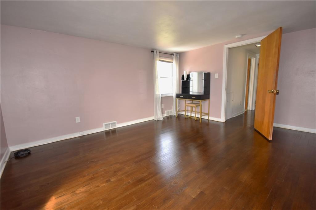 104 Earlwood Road Pittsburgh, PA 15235 - Photo 27 of 40 a view of a livingroom with wooden floor and a window