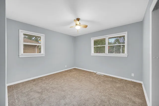 a view of an empty room with storage