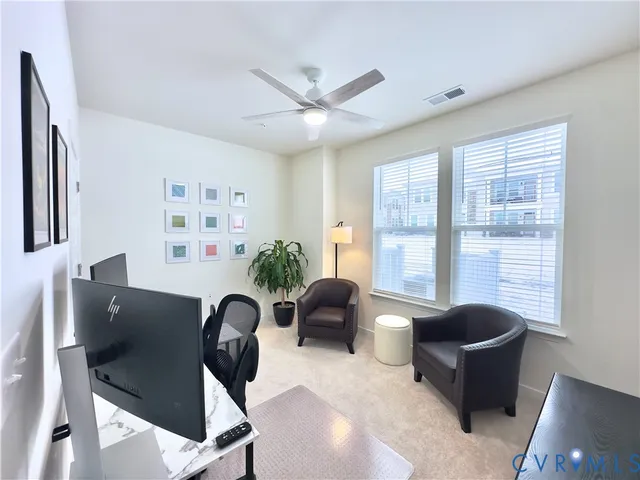 a living room with furniture and windows