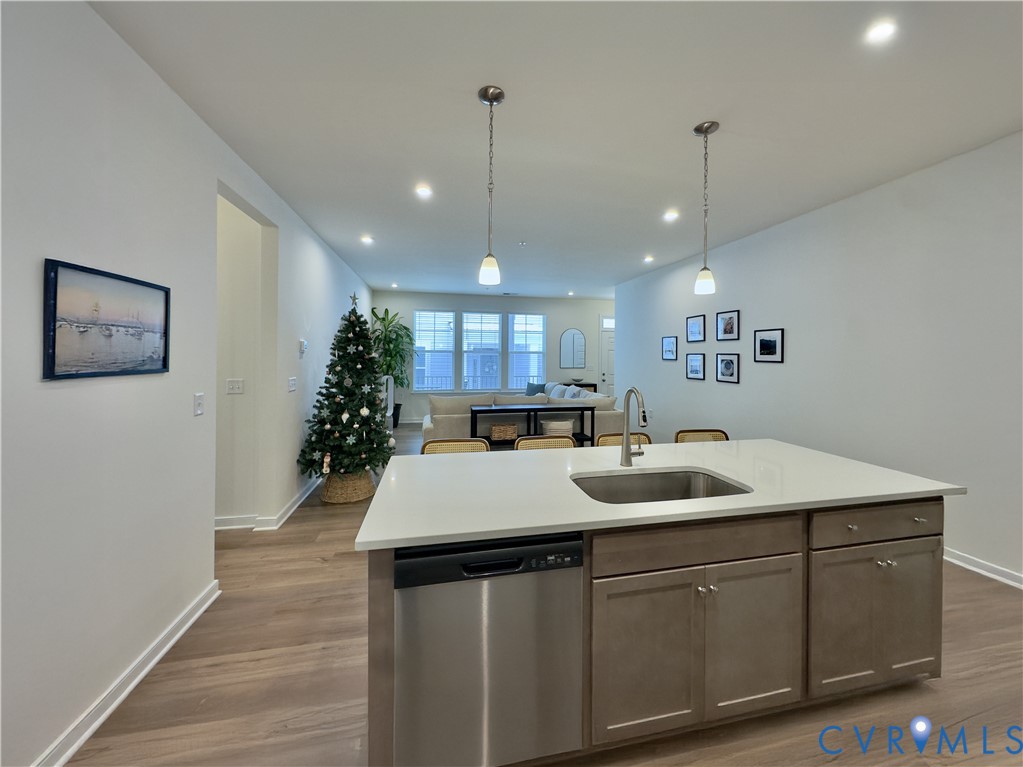 12423 Wescott Avenue Midlothian, VA 23112 - Photo 18 of 25 a kitchen with a sink chandelier and wooden floor