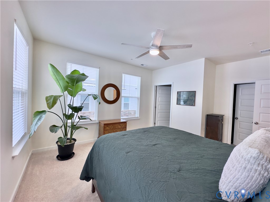 12423 Wescott Avenue Midlothian, VA 23112 - Photo 8 of 25 a bed room with a bed and a chandelier