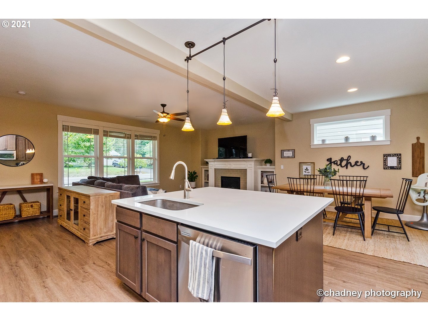 19747 Leland Road Oregon City, OR 97045 - Photo 8 of 32 a kitchen with a stove a counter space dining table and chairs