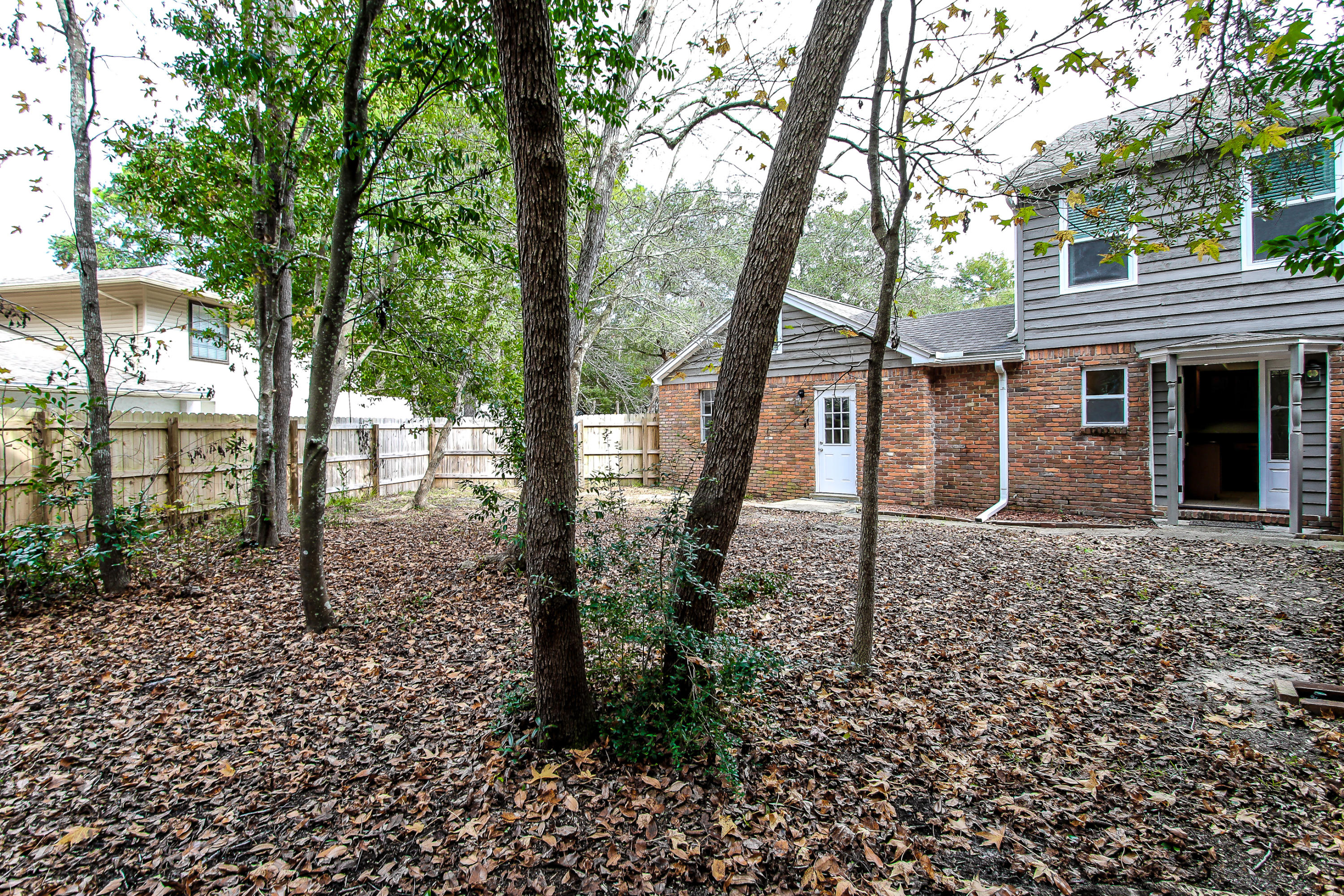237 Country Club Road Shalimar, FL 32579 - Photo 16 of 74 a backyard of a house with lots of green space