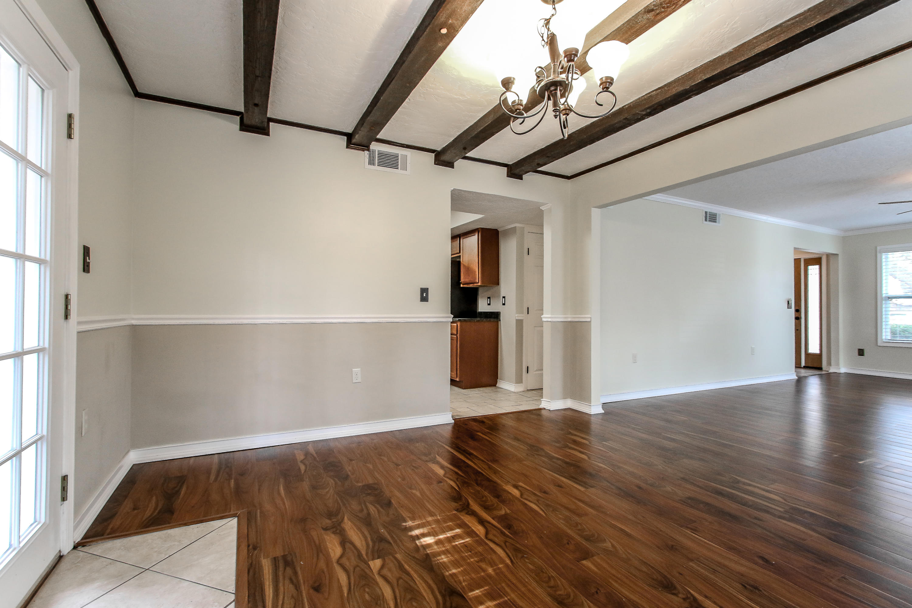 237 Country Club Road Shalimar, FL 32579 - Photo 22 of 74 a view of an empty room with wooden floor and a window