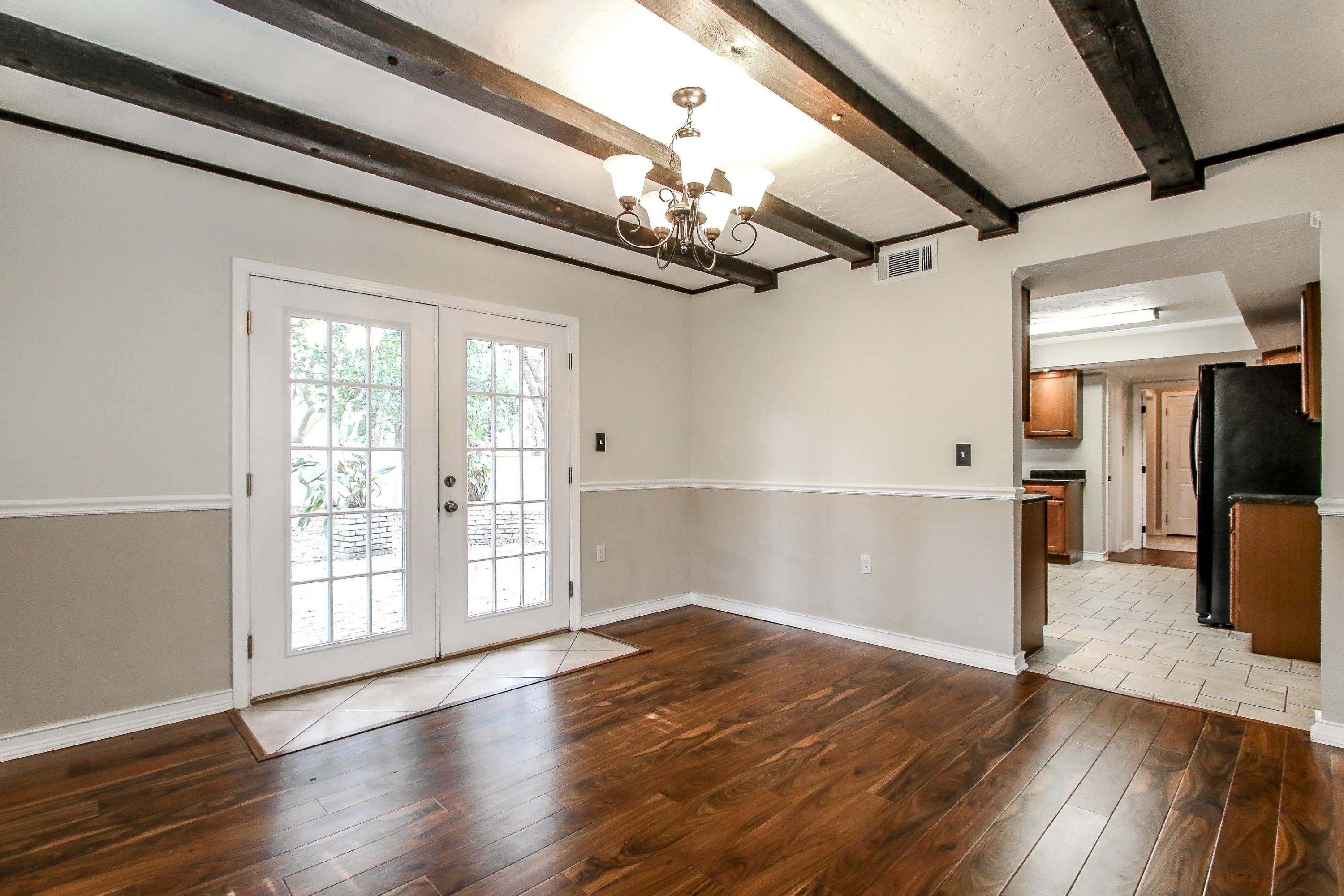 237 Country Club Road Shalimar, FL 32579 - Photo 24 of 74 a view of an empty room with wooden floor and a window
