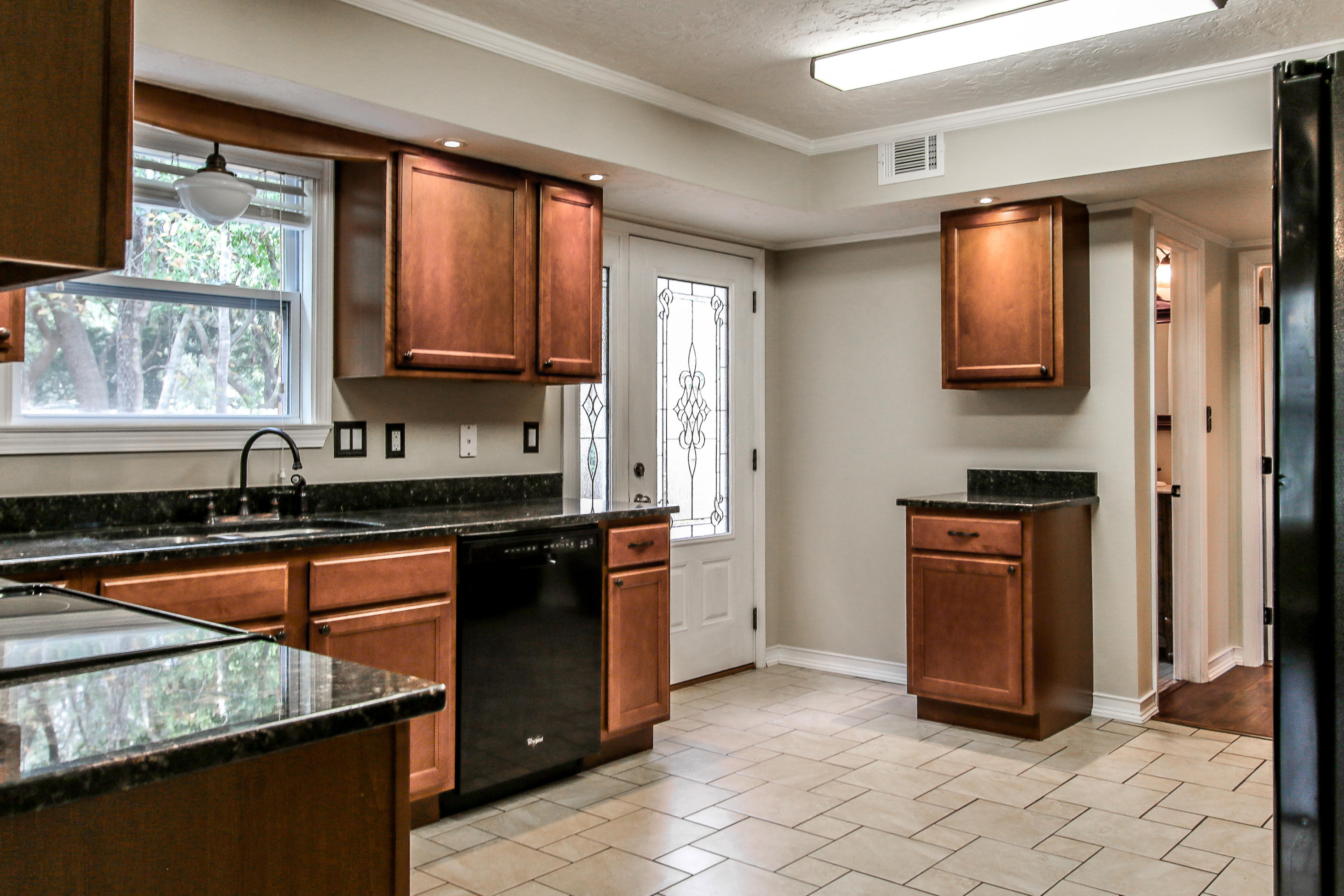 237 Country Club Road Shalimar, FL 32579 - Photo 28 of 74 a kitchen with stainless steel appliances granite countertop a stove a sink and a microwave