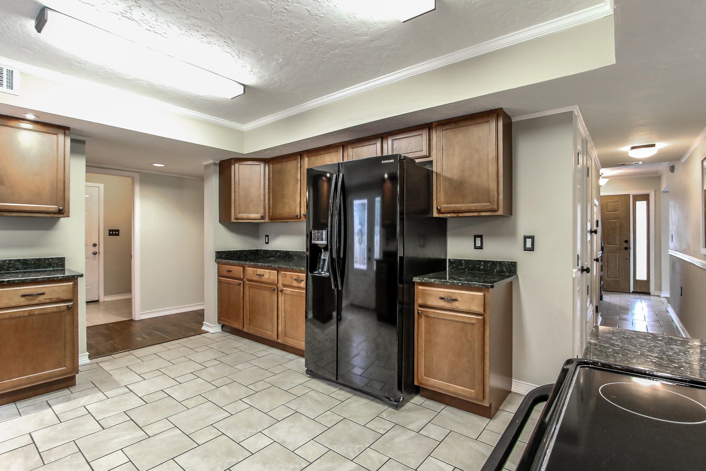 237 Country Club Road Shalimar, FL 32579 - Photo 33 of 74 a kitchen with stainless steel appliances granite countertop a refrigerator a stove and a sink