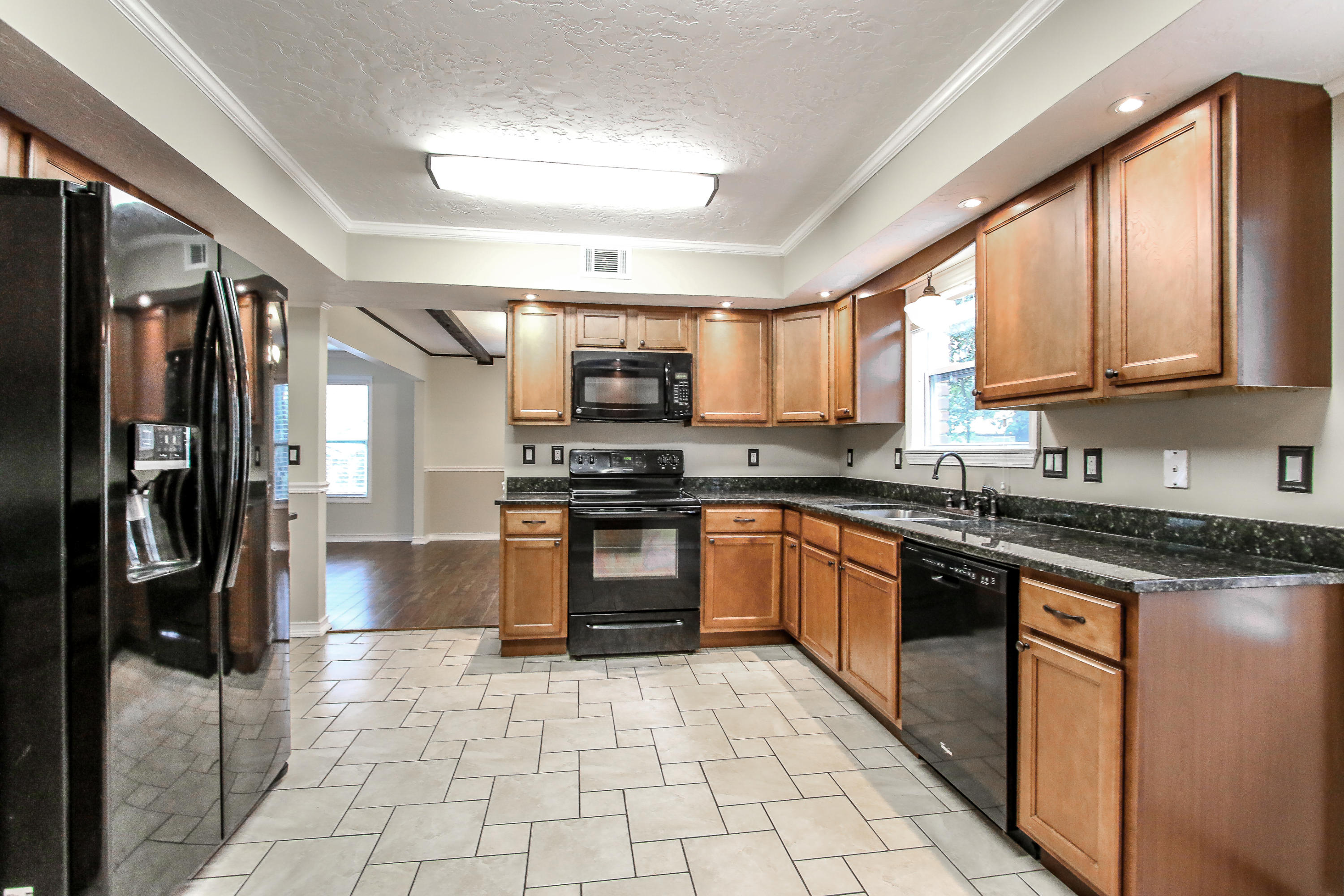 237 Country Club Road Shalimar, FL 32579 - Photo 34 of 74 a large kitchen with stainless steel appliances granite countertop a stove granite counter tops and a view of living room