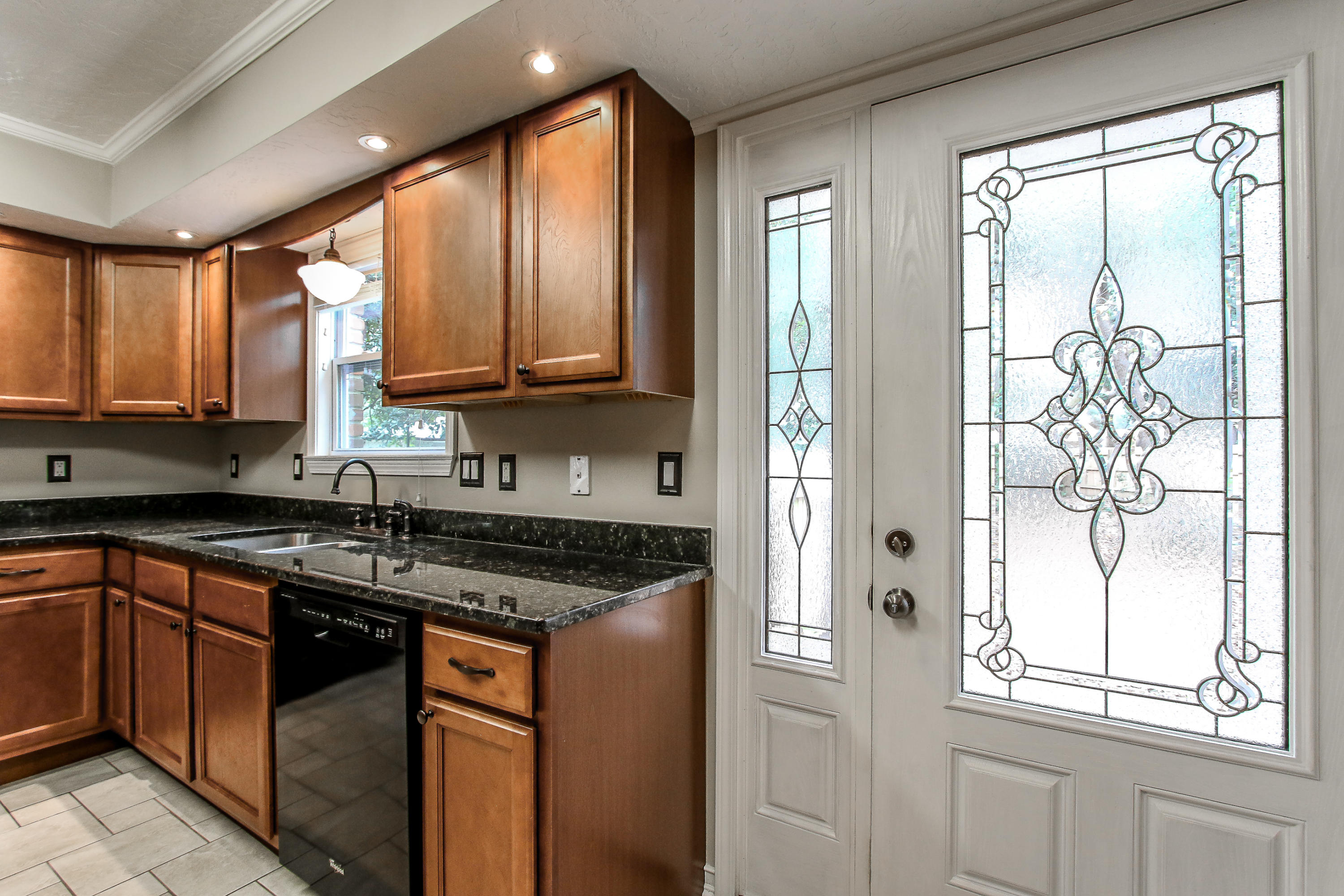 237 Country Club Road Shalimar, FL 32579 - Photo 35 of 74 a kitchen with stainless steel appliances granite countertop a stove a sink and a microwave