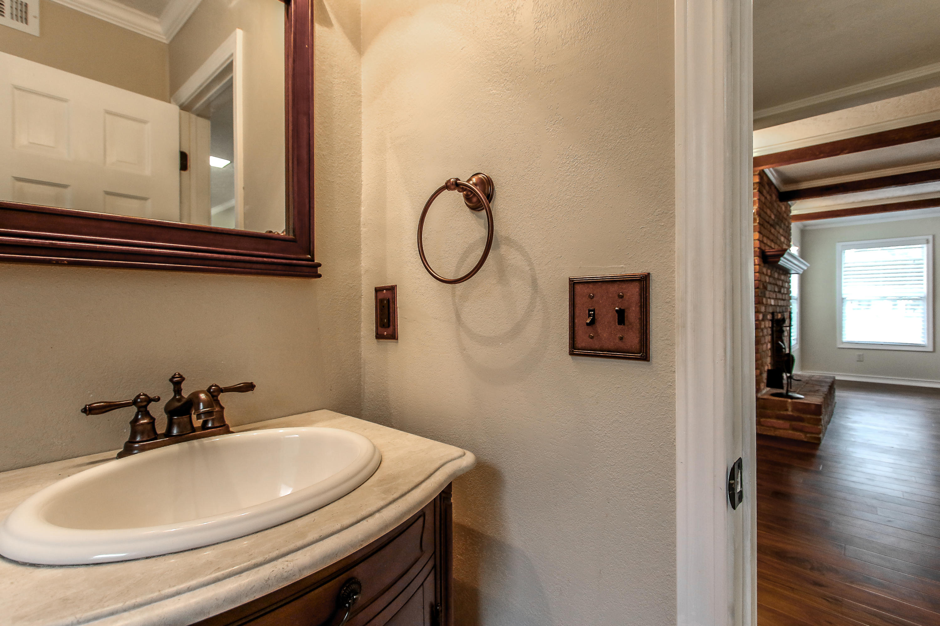 237 Country Club Road Shalimar, FL 32579 - Photo 39 of 74 a bathroom with a sink and a mirror