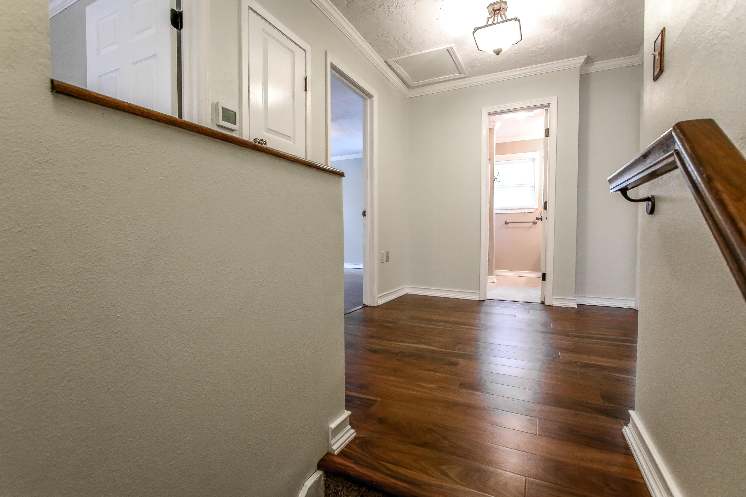 237 Country Club Road Shalimar, FL 32579 - Photo 47 of 74 a view of an empty room with wooden floor and a window