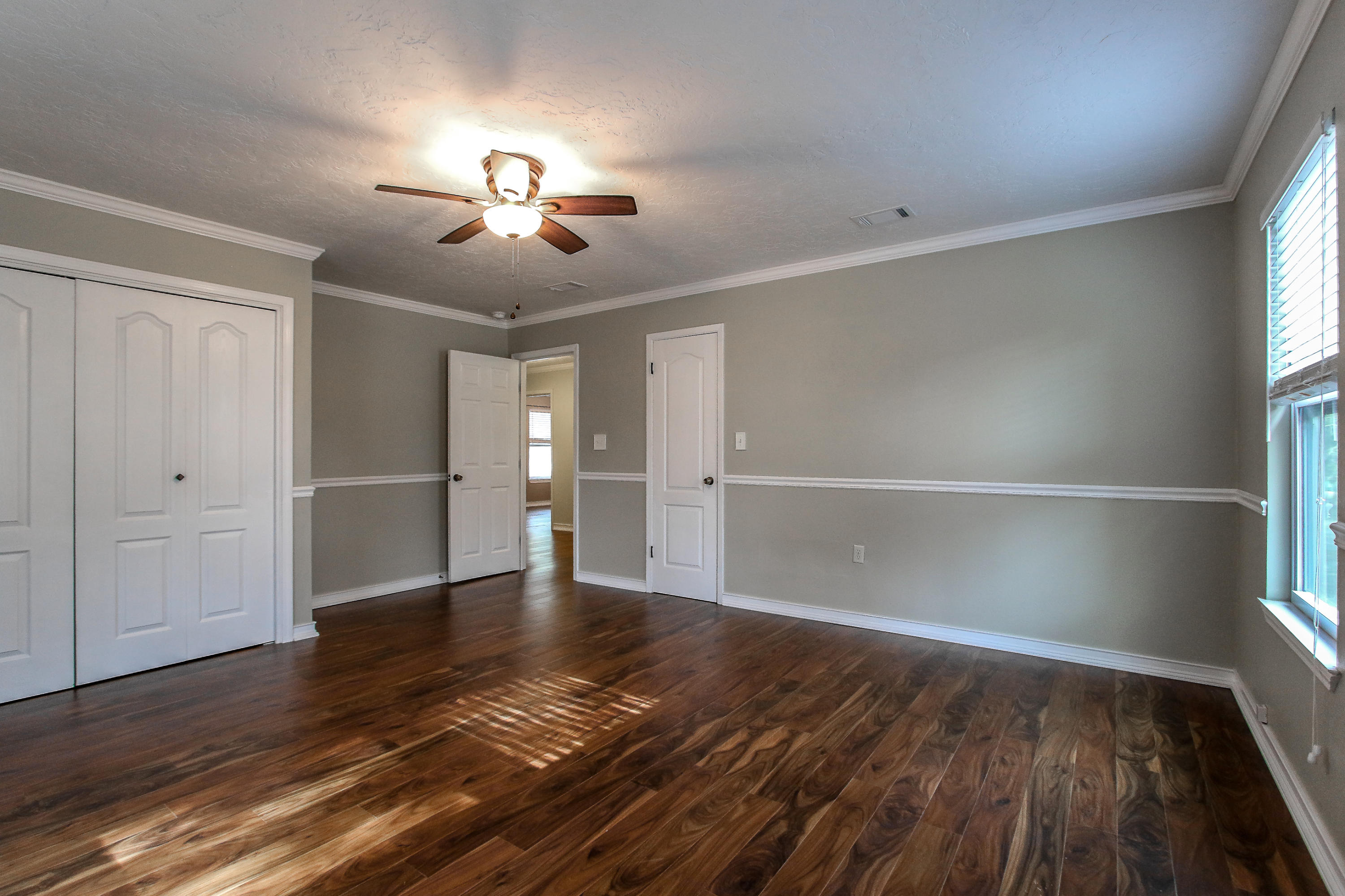 237 Country Club Road Shalimar, FL 32579 - Photo 52 of 74 wooden floor in an empty room with a window