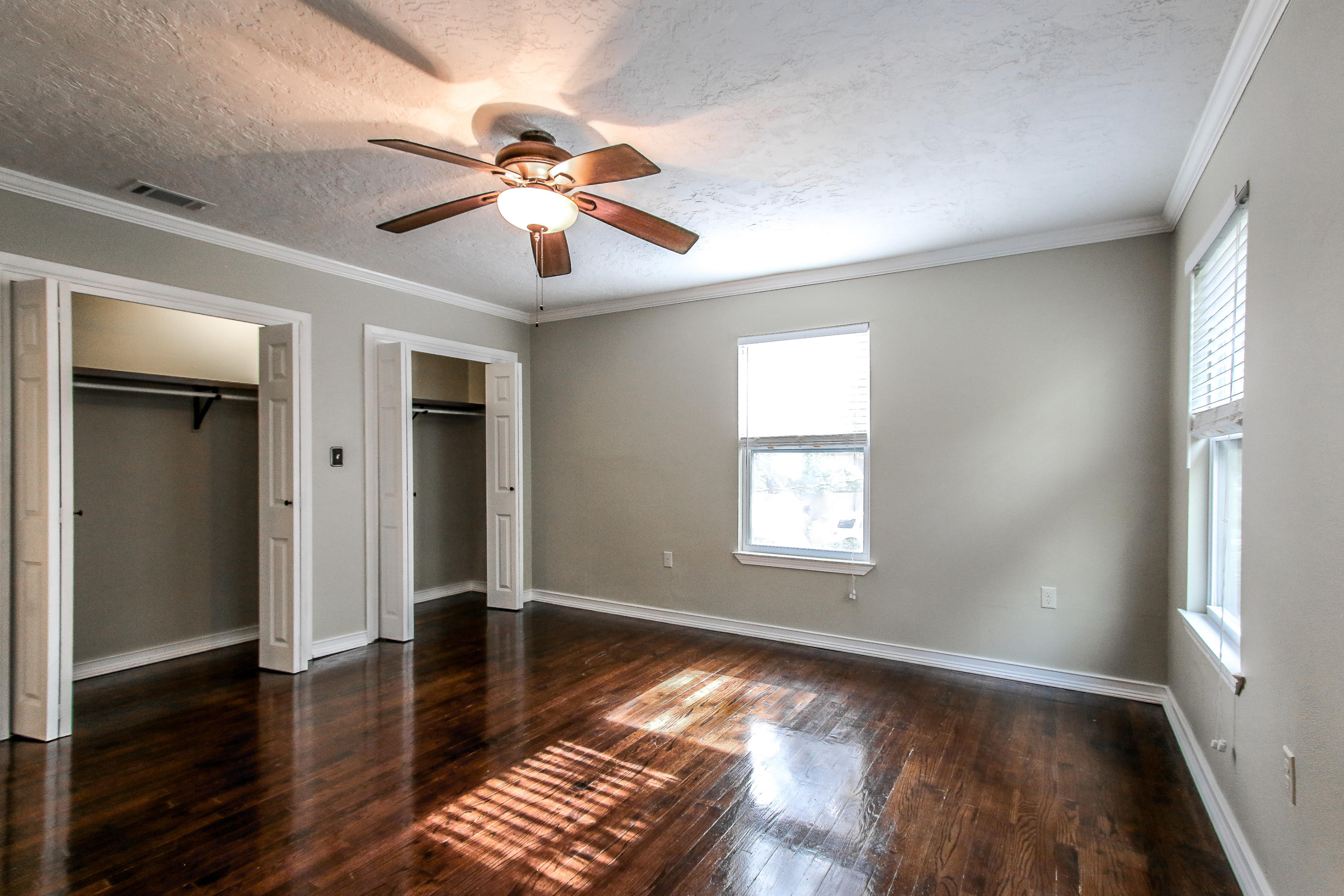 237 Country Club Road Shalimar, FL 32579 - Photo 53 of 74 a view of an empty room with wooden floor and a window