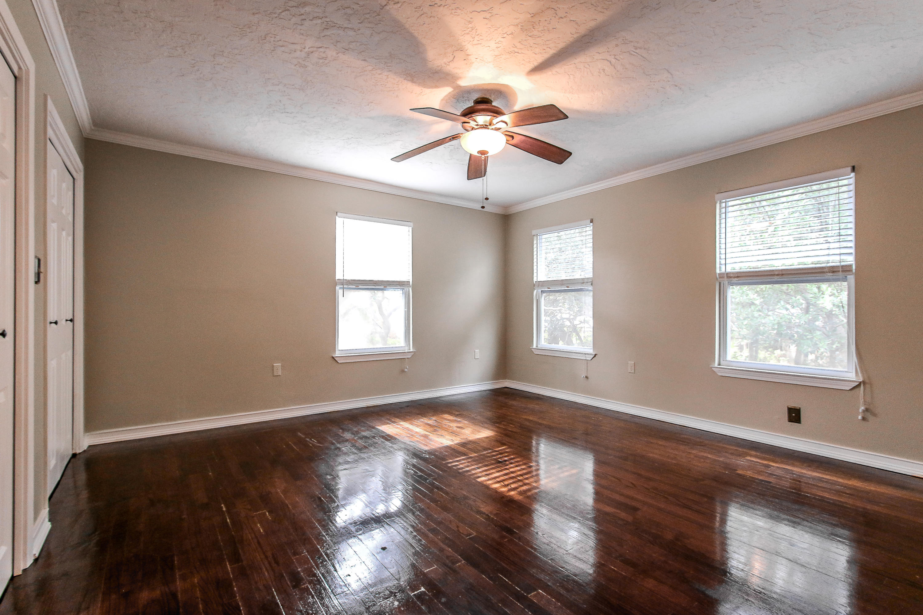 237 Country Club Road Shalimar, FL 32579 - Photo 54 of 74 a view of an empty room with wooden floor and a window