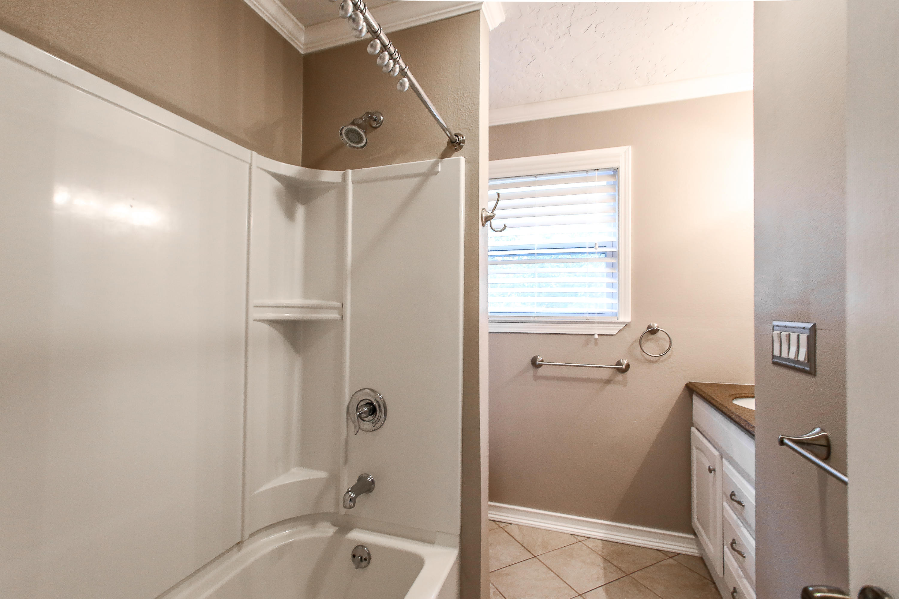 237 Country Club Road Shalimar, FL 32579 - Photo 55 of 74 a bathroom with a granite countertop sink a mirror and a bathtub