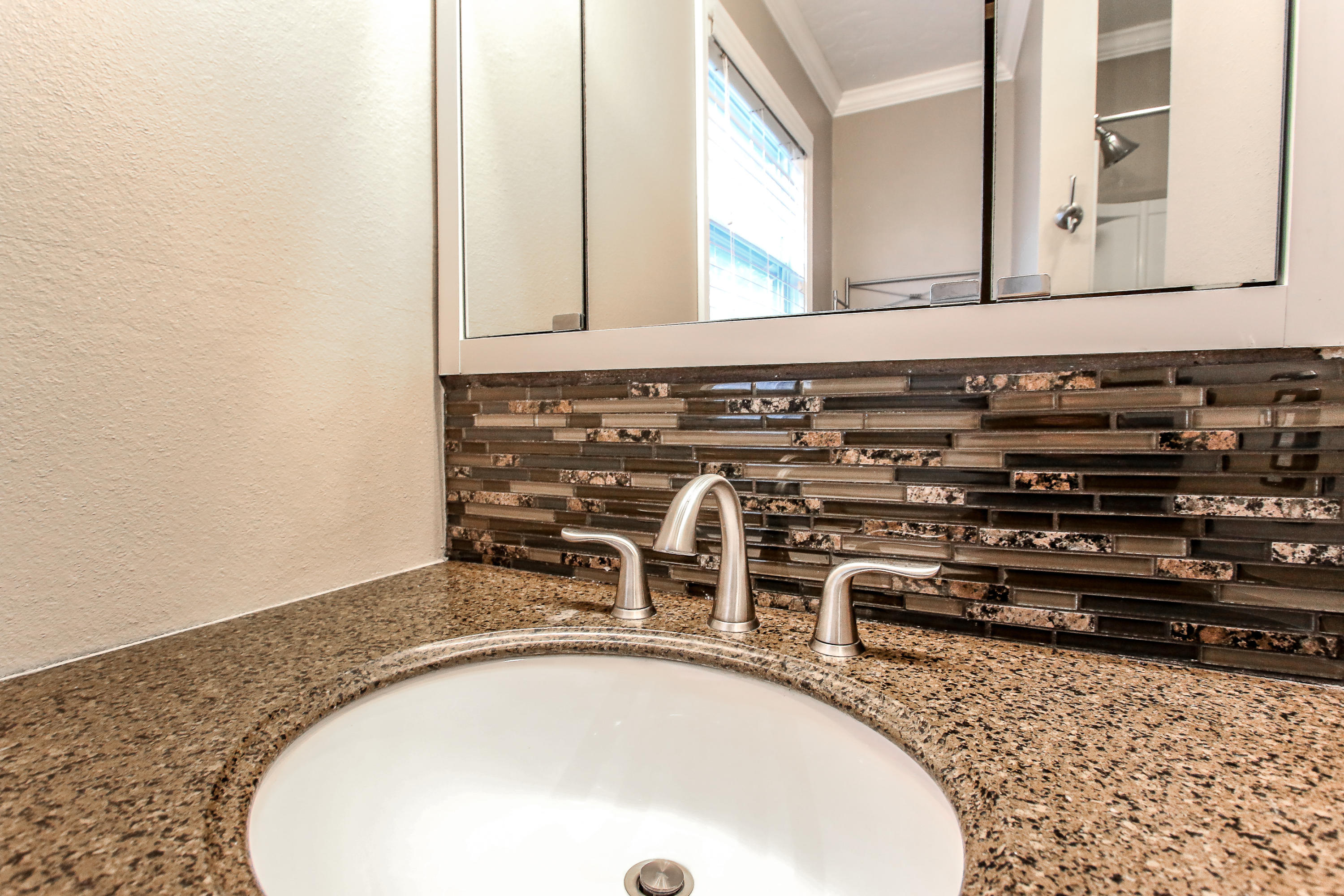 237 Country Club Road Shalimar, FL 32579 - Photo 57 of 74 a bathroom with a granite countertop sink and a mirror