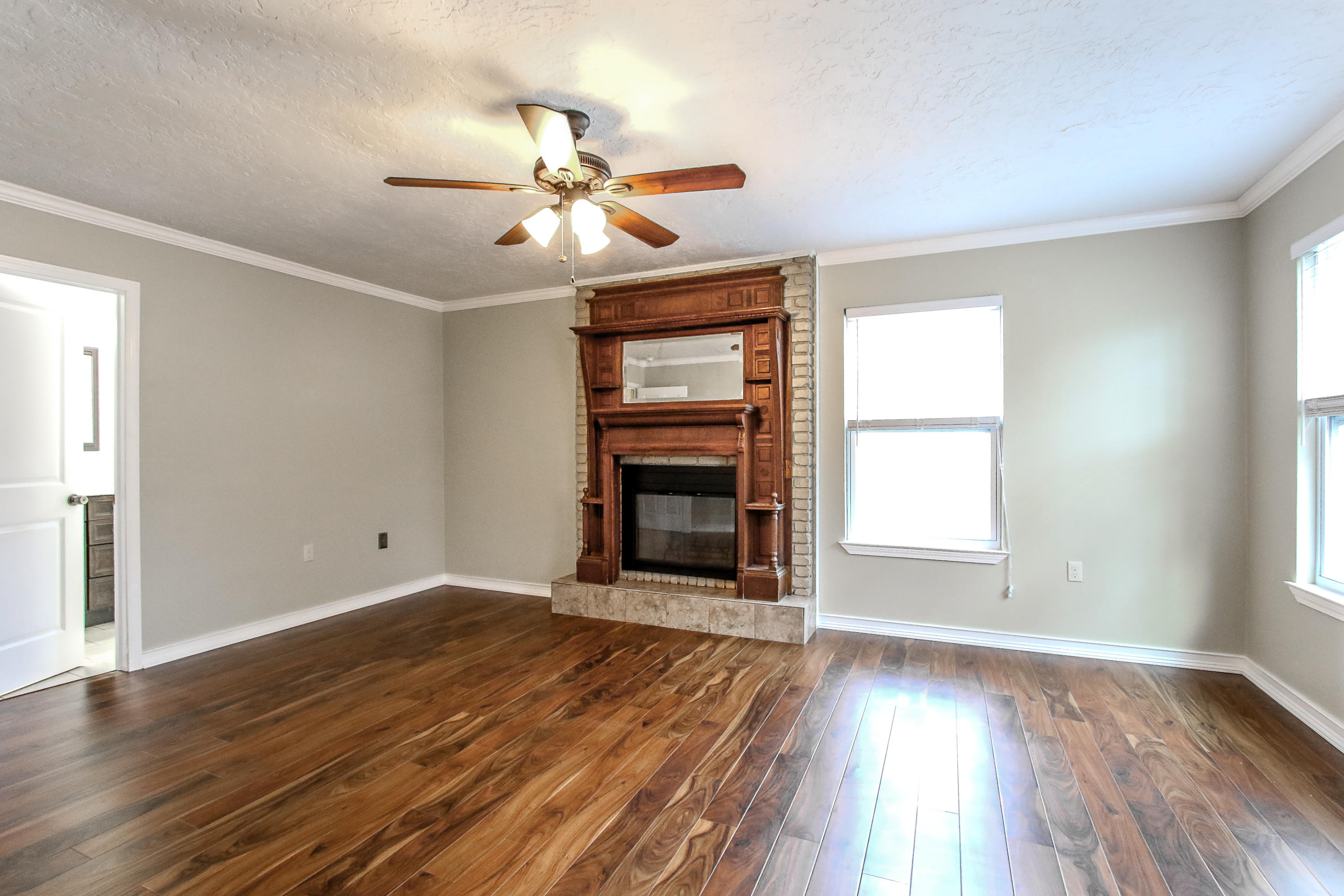 237 Country Club Road Shalimar, FL 32579 - Photo 60 of 74 an empty room with wooden floor fan and windows
