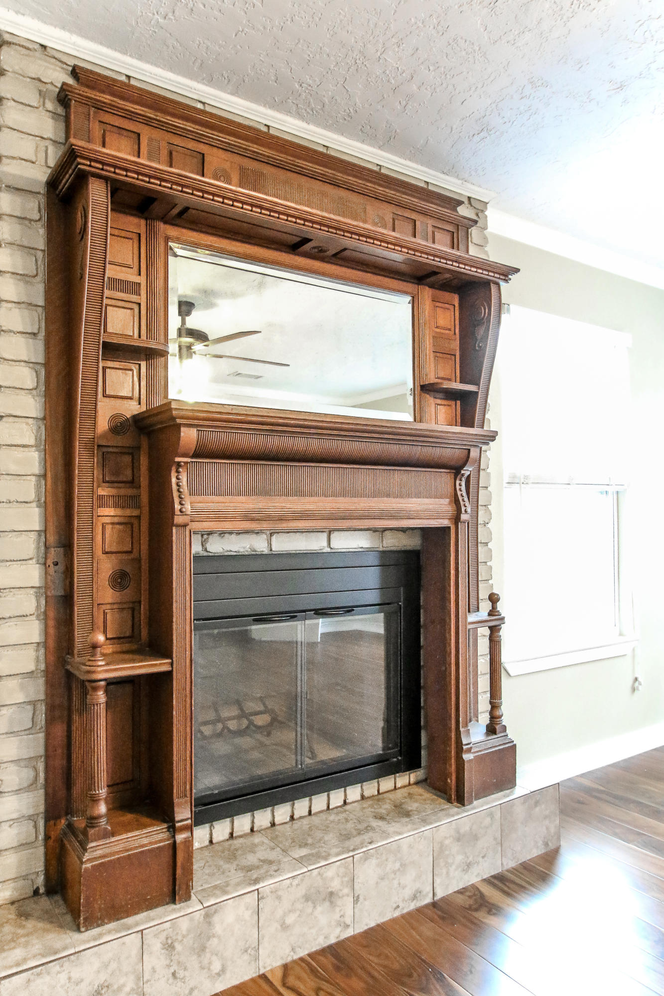 237 Country Club Road Shalimar, FL 32579 - Photo 63 of 74 a view of a livingroom with wooden floor and a fireplace