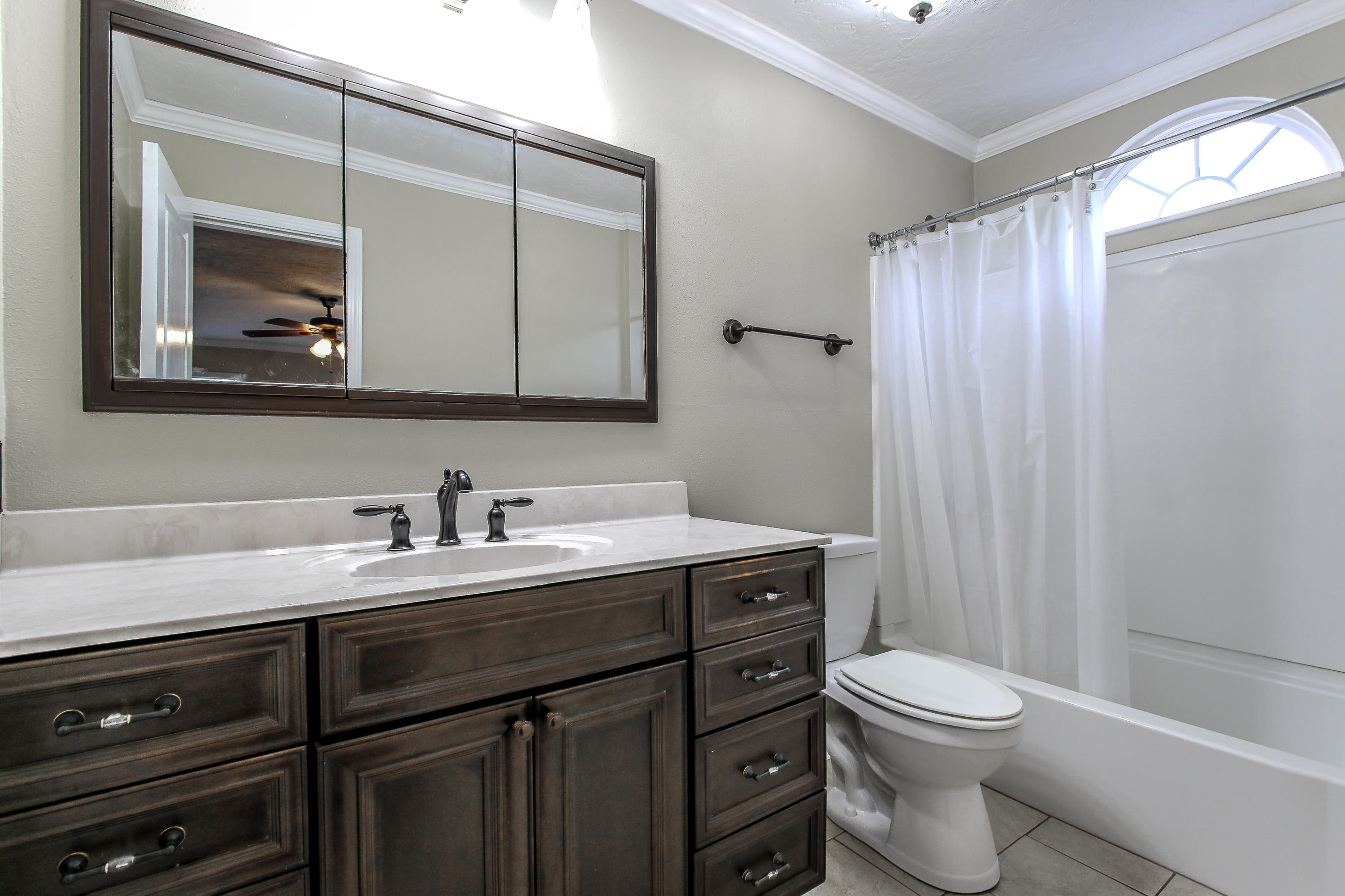 237 Country Club Road Shalimar, FL 32579 - Photo 69 of 74 a bathroom with a toilet sink vanity and mirror