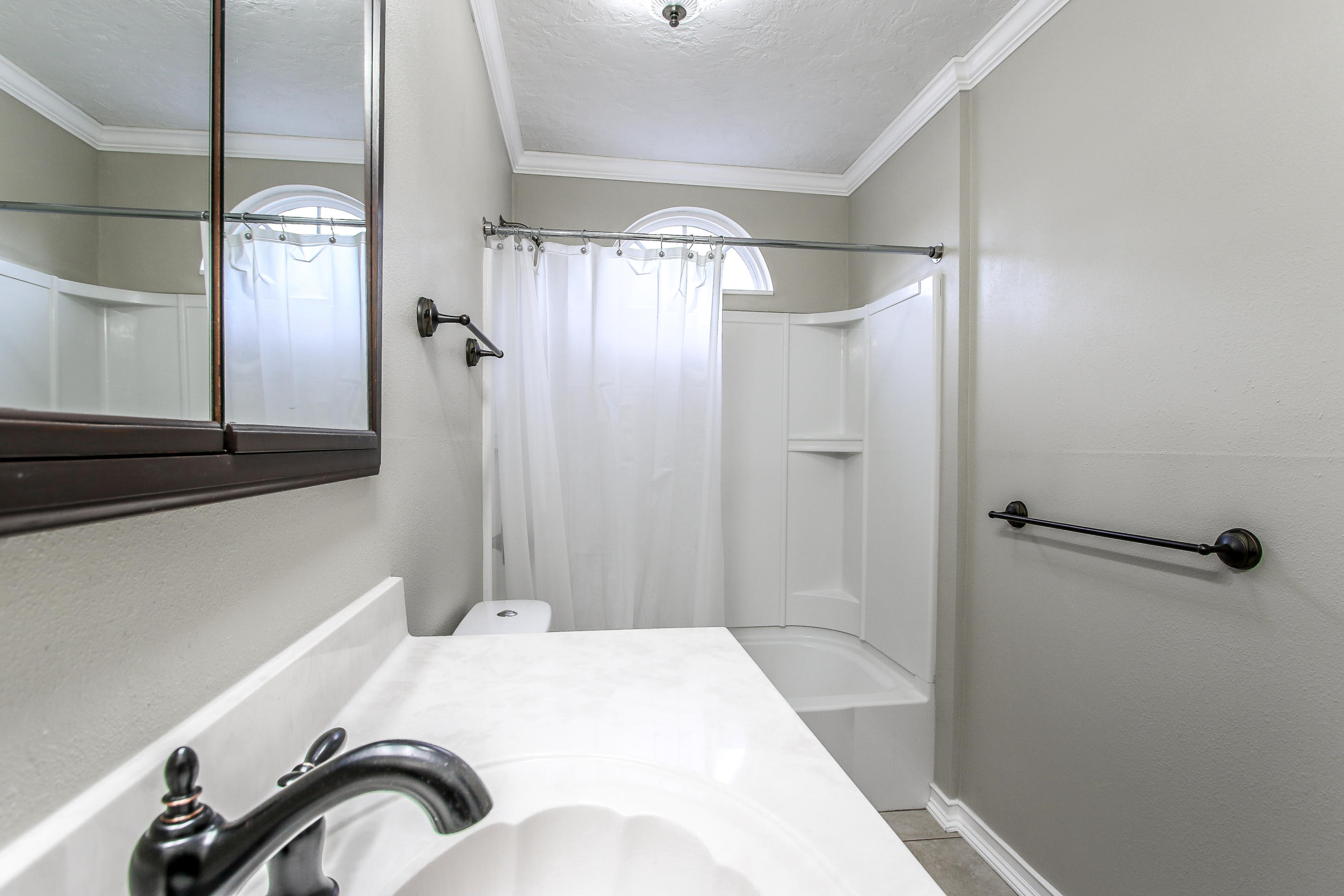 237 Country Club Road Shalimar, FL 32579 - Photo 70 of 74 a bathroom with a bathtub and a shower