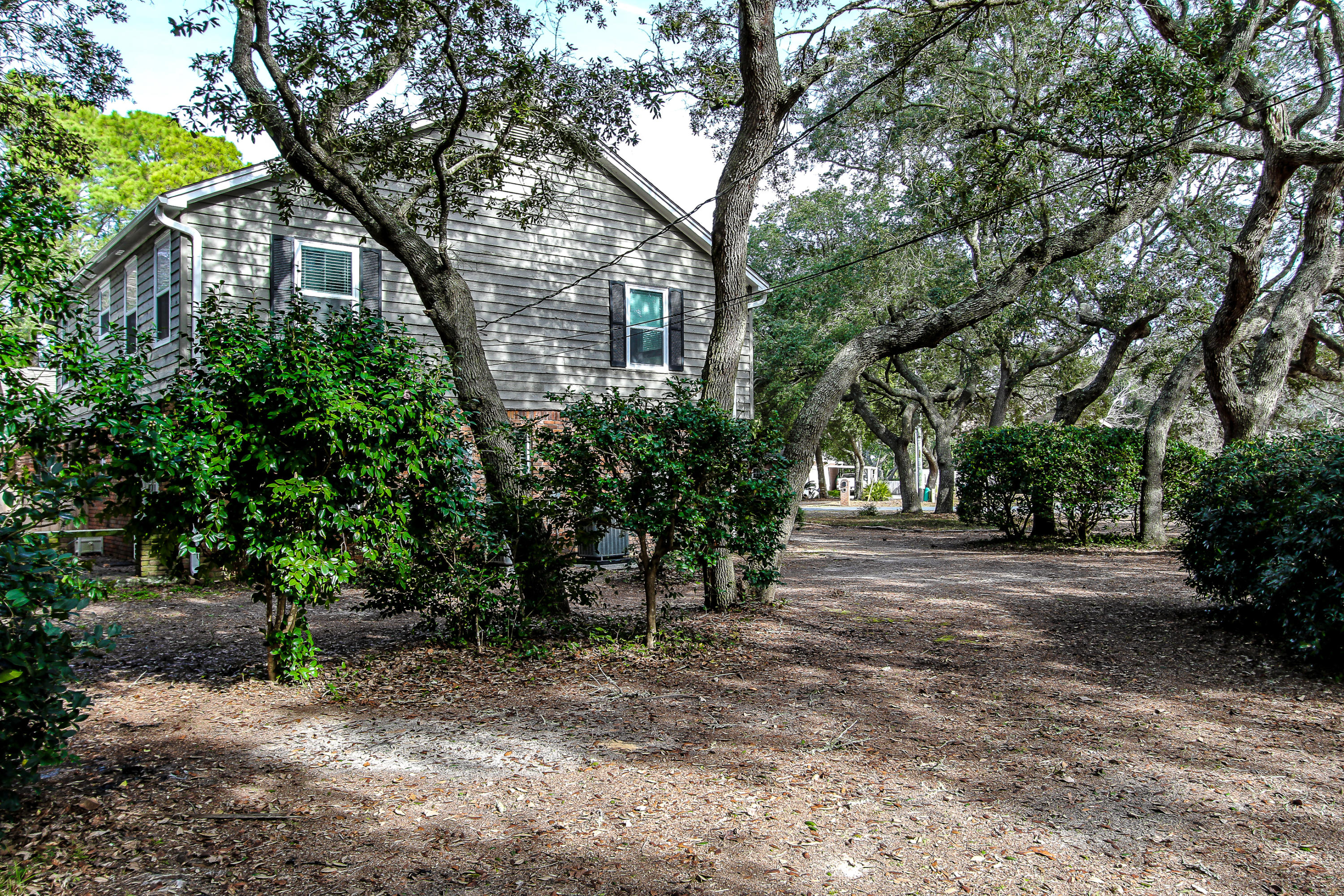 237 Country Club Road Shalimar, FL 32579 - Photo 8 of 74 a view of a yard with plants and trees