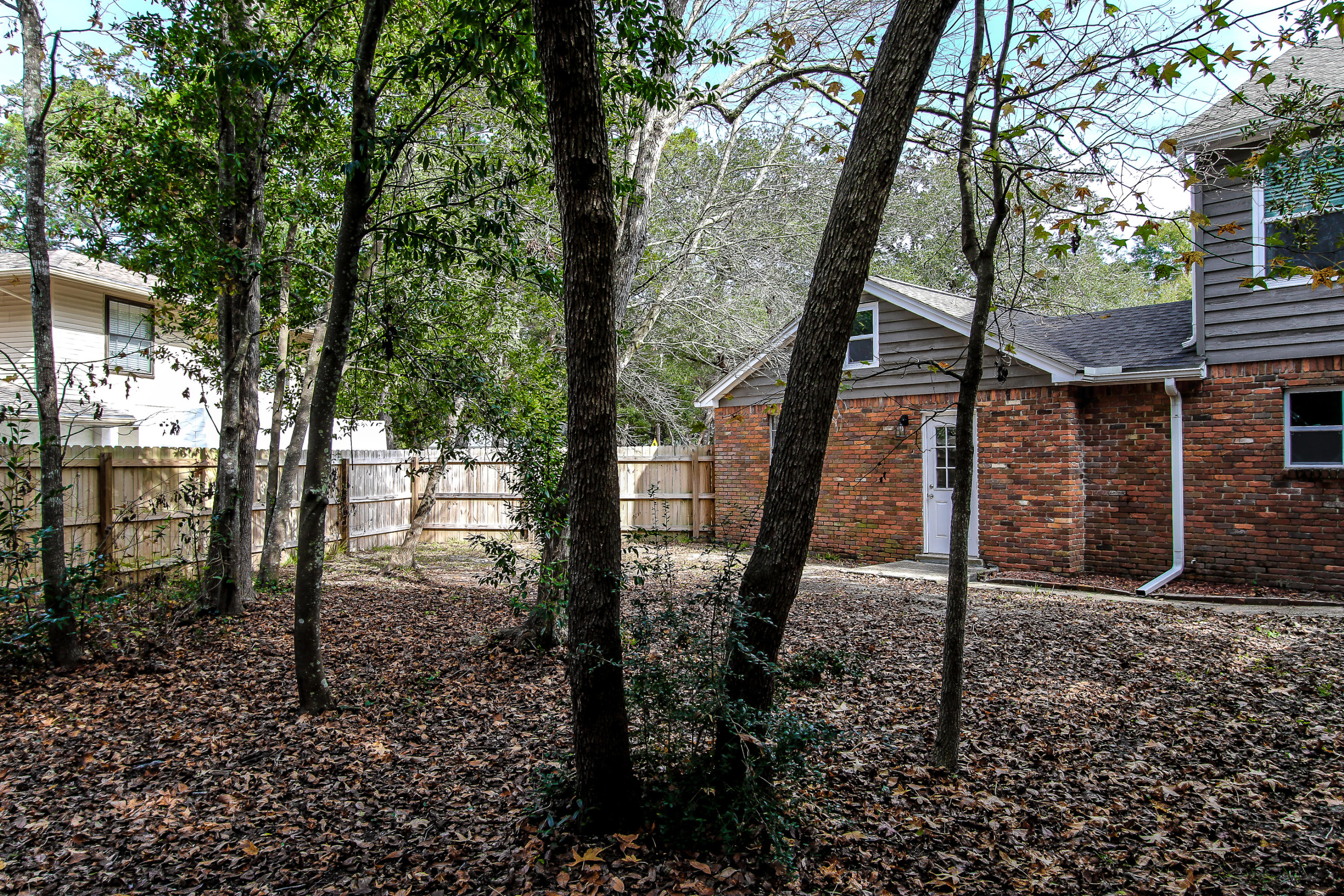 237 Country Club Road Shalimar, FL 32579 - Photo 10 of 74 a backyard of a house with lots of green space