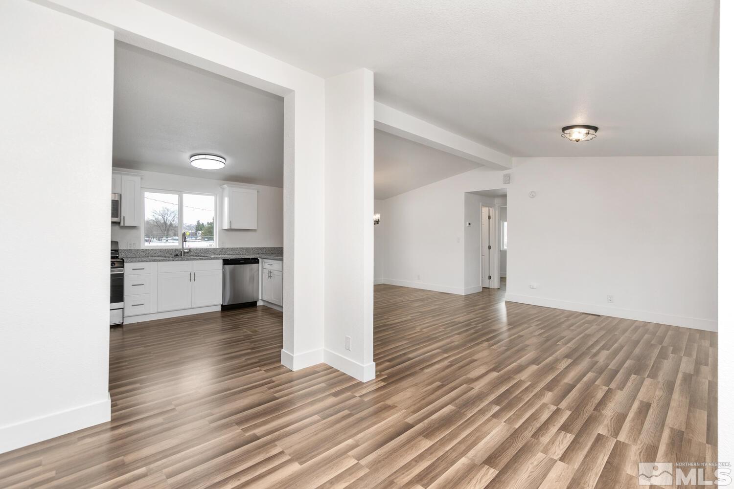 17530 Fantail Street Reno, NV 89508 - Photo 8 of 27 a view of a kitchen cabinets wooden floor and a kitchen