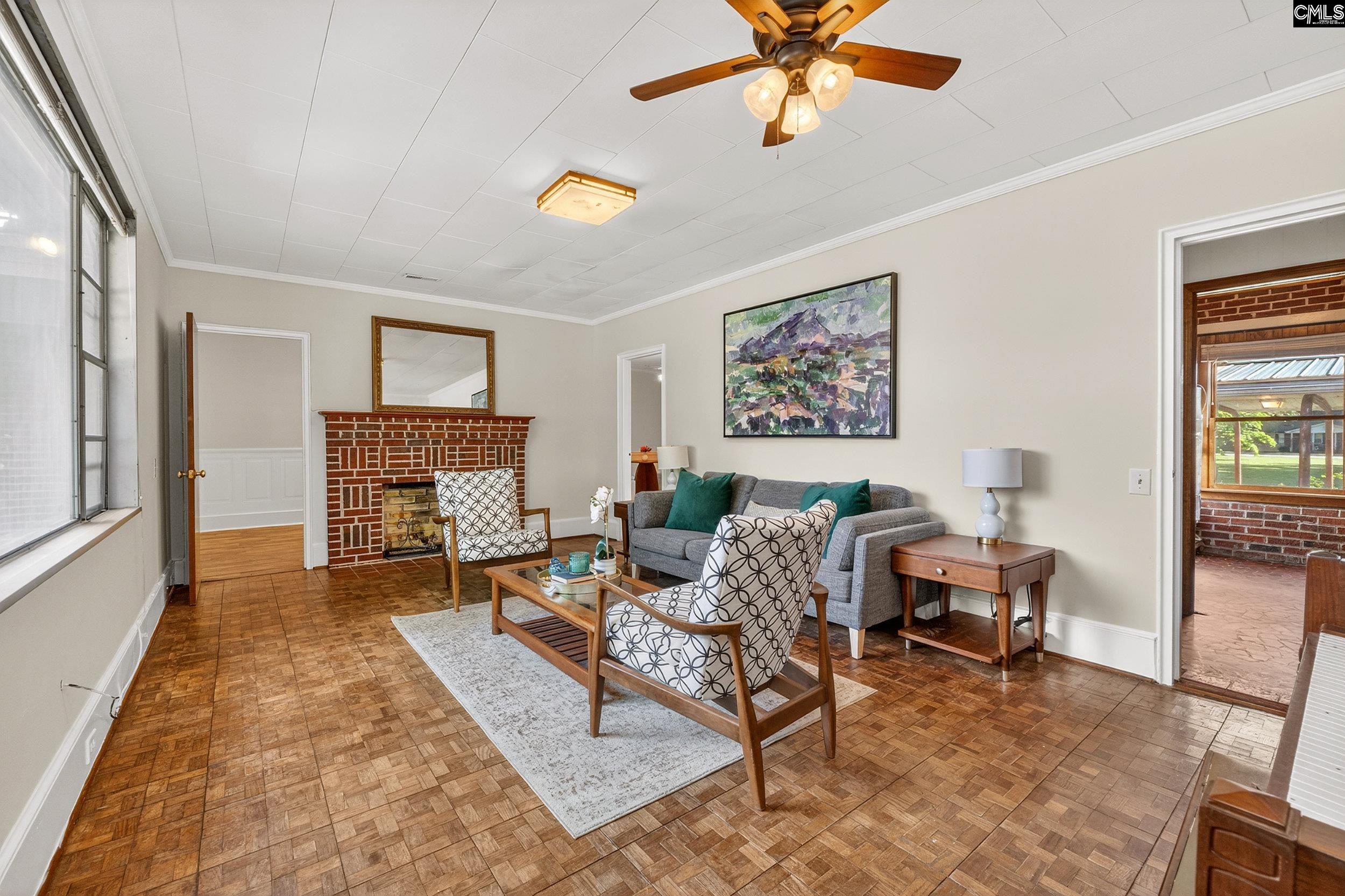 729 Magnolia Street Pelion, SC 29123 - Photo 4 of 32 a living room with furniture and a fireplace