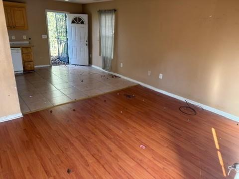 3470 Lawton Road Macon, GA 31204 - Photo 2 of 8 wooden floor in an empty room with a window