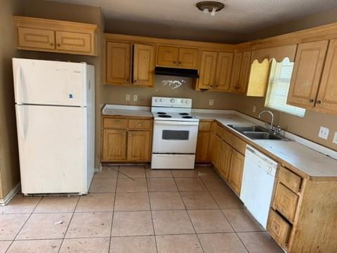 3470 Lawton Road Macon, GA 31204 - Photo 3 of 8 a kitchen with a stove a refrigerator and a sink