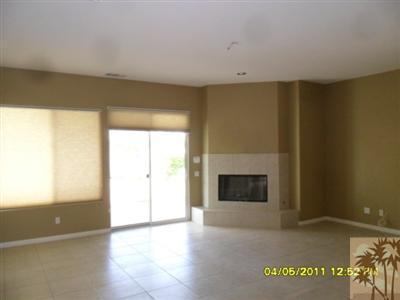 23 Napoleon Road Rancho Mirage, CA 92270 - Photo 4 of 7 a view of an empty room with a fireplace and a window