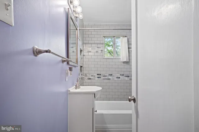 a bathroom with a sink and a shower