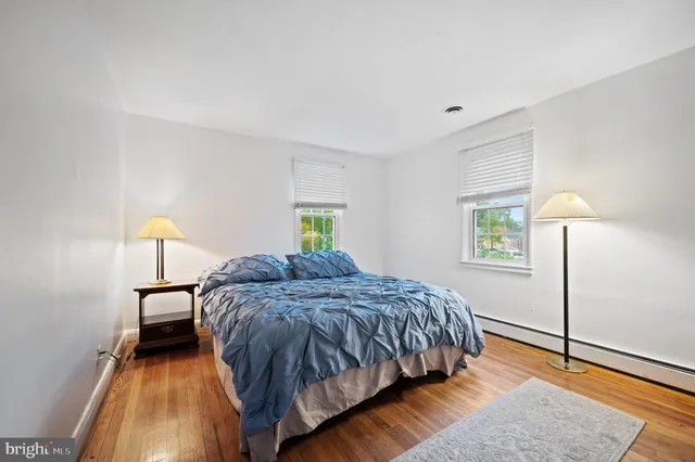 a bedroom with a bed and a lamp