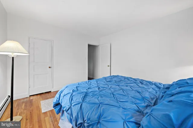 a bedroom with a bed and a closet