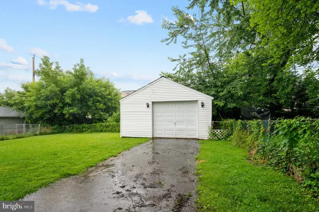 a view of a house with yard and a garden