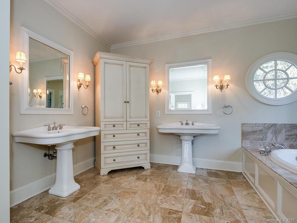 1900 Harris Road Charlotte, NC 28211 - Photo 13 of 24 a bathroom with a sink and a mirror