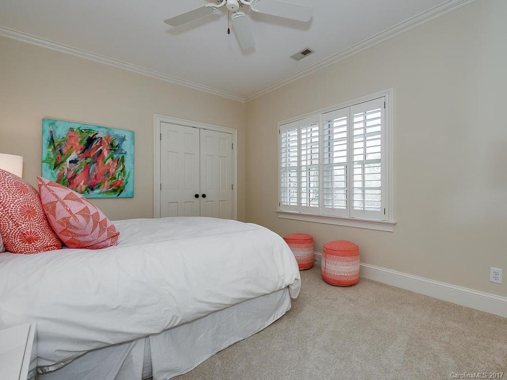 1900 Harris Road Charlotte, NC 28211 - Photo 14 of 24 a bedroom with a bed and a painting on the wall
