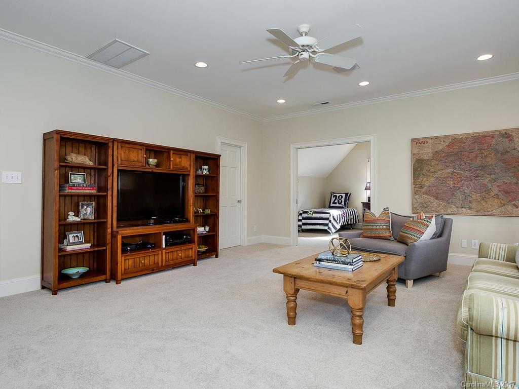 1900 Harris Road Charlotte, NC 28211 - Photo 17 of 24 a living room with furniture and a flat screen tv