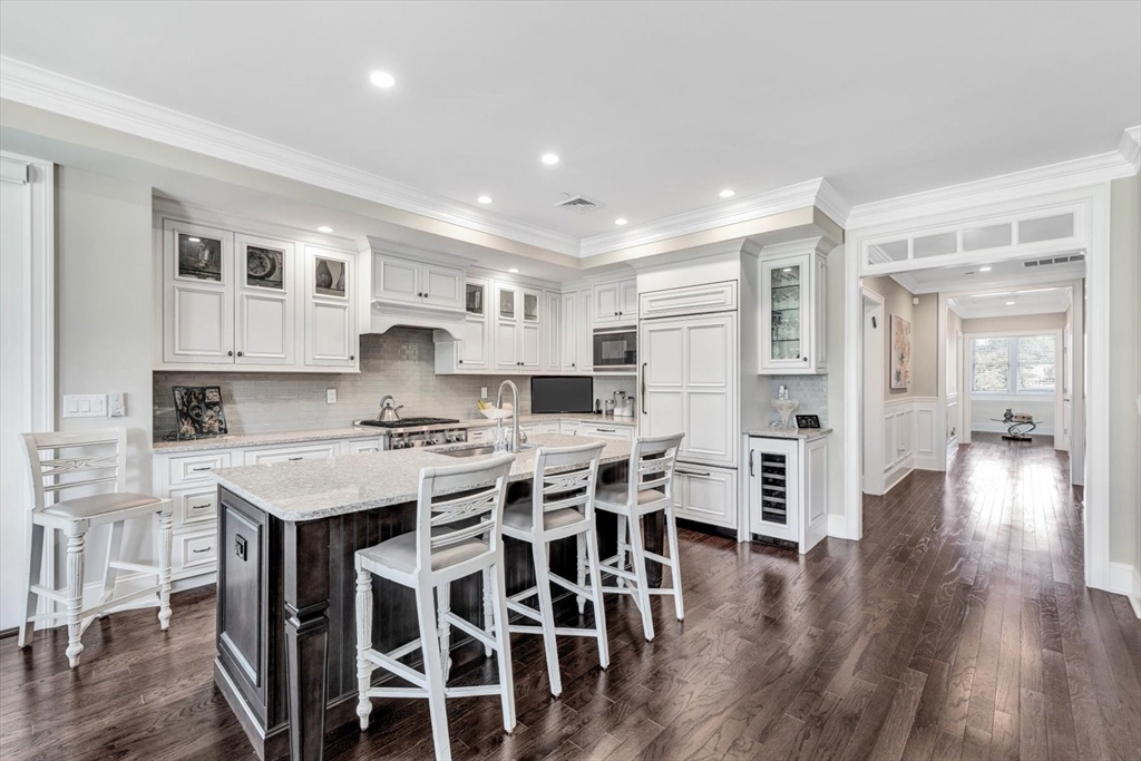 66 D Simons Road, Unit D Mashpee, MA 02649 - Photo 13 of 27 a large kitchen with lots of counter space and stainless steel appliances