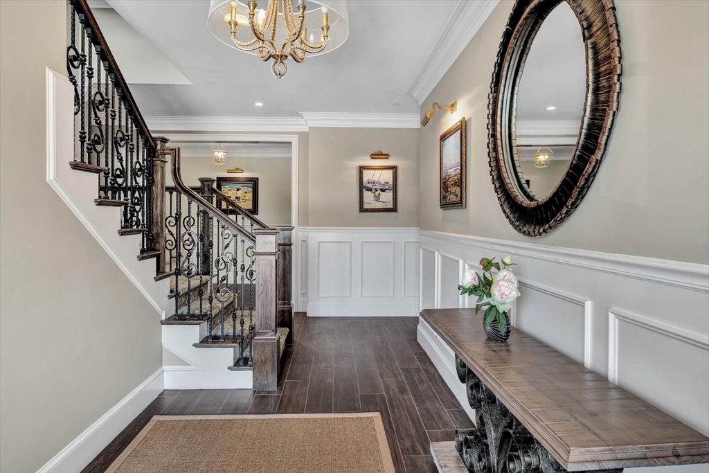 66 D Simons Road, Unit D Mashpee, MA 02649 - Photo 8 of 27 a view of a hallway with wooden floor and entryway