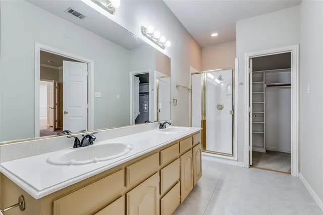 a bathroom with a sink tub shower and a mirror