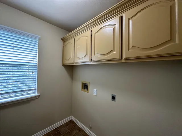 a bathroom with a sink a mirror and window
