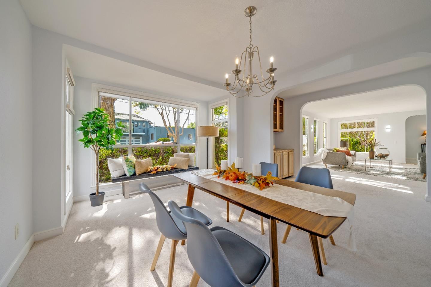 40 Bloomfield Road Burlingame, CA 94010 - Photo 12 of 45 a living room with furniture a chandelier and a dining room