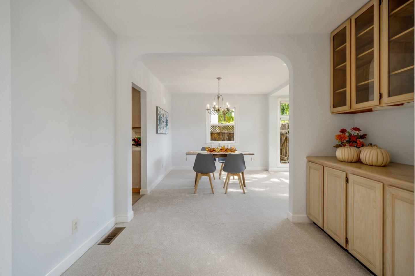 40 Bloomfield Road Burlingame, CA 94010 - Photo 13 of 45 a dining room with furniture and a chandelier