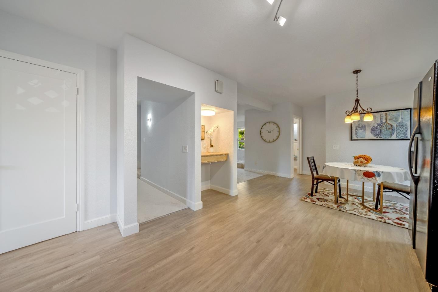 40 Bloomfield Road Burlingame, CA 94010 - Photo 20 of 45 a living room with couches and kitchen view with wooden floor